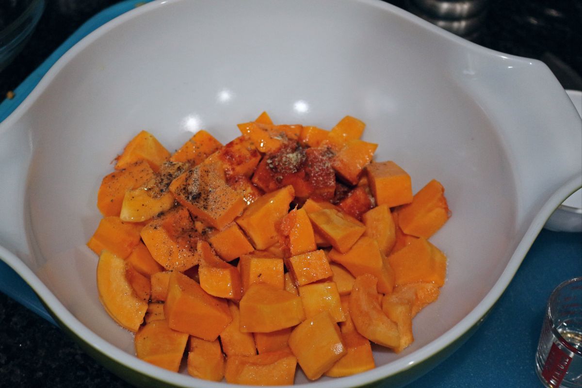 chopped squash in a bowl with spices