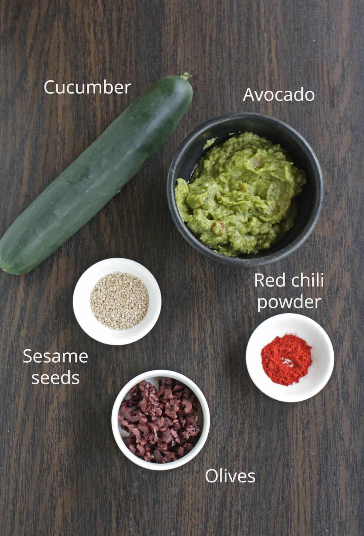 Ingredients labeled to make cucumber avocado rolls