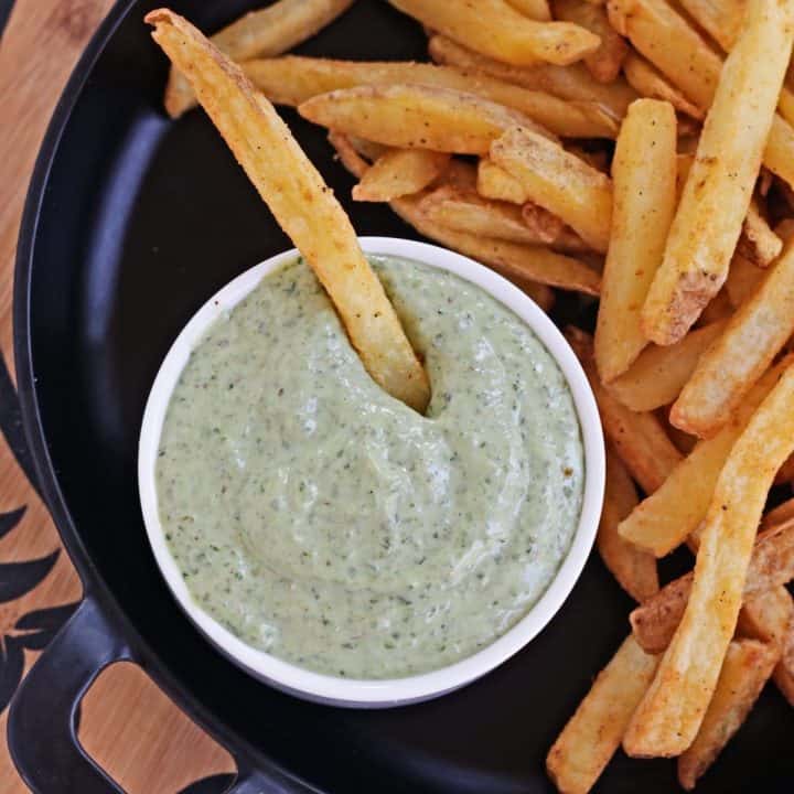 Basil pesto in a bowl.