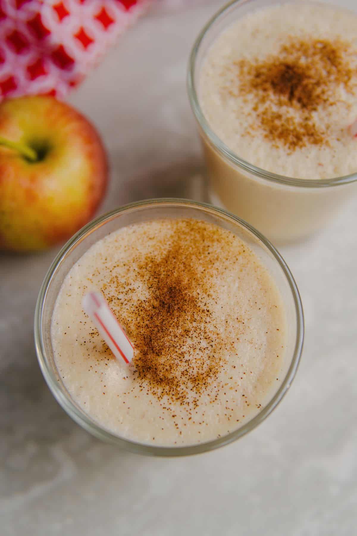 Apple smoothie with cinnamon powder on top.
