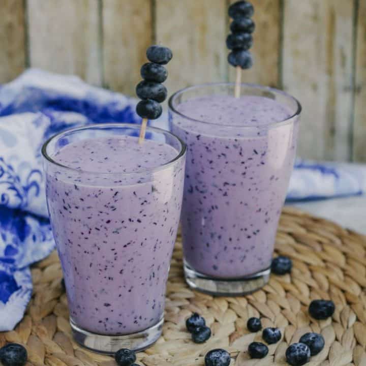 two glasses of lassi with blueberry