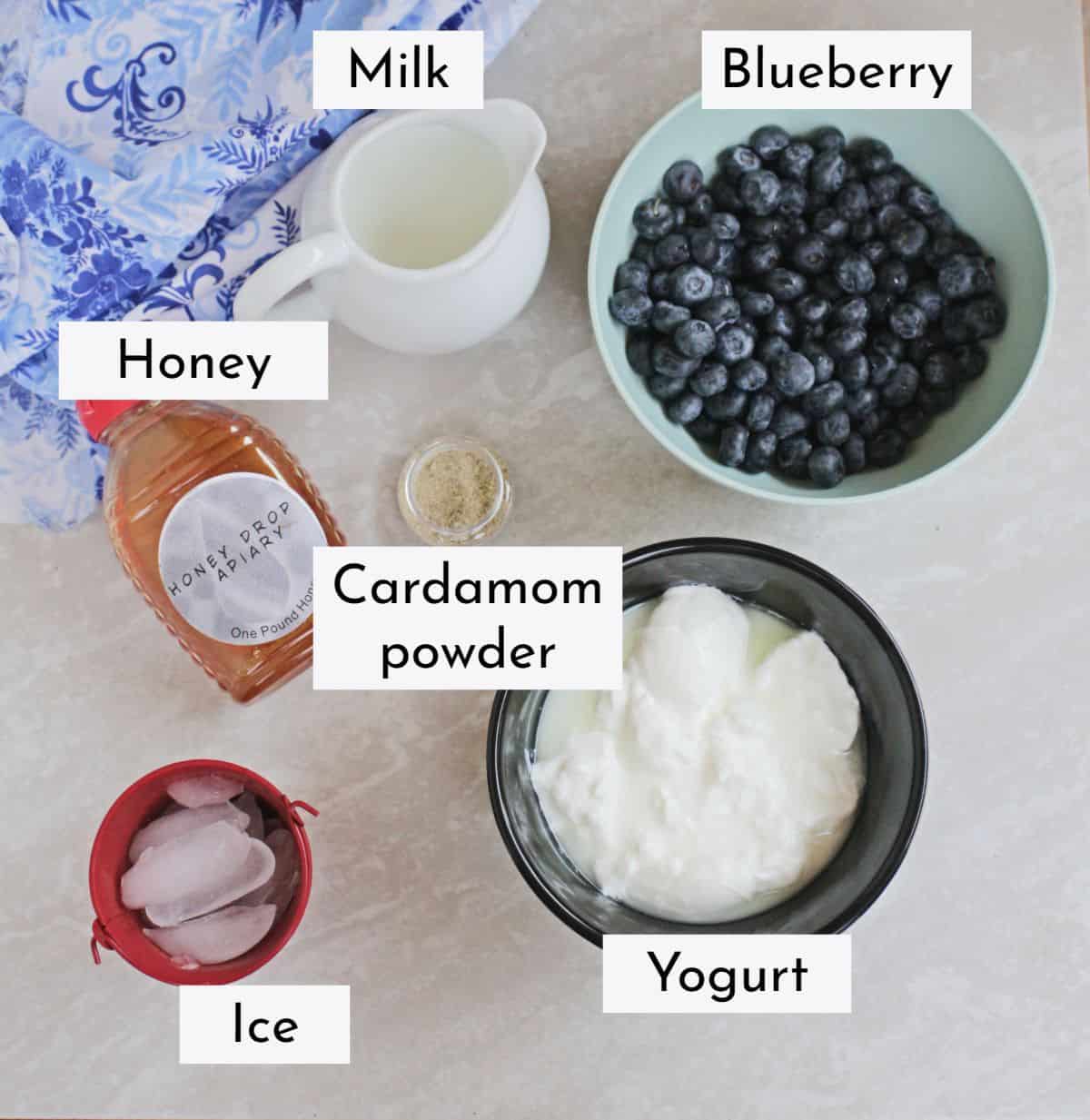Ingredients needed to make blueberry lassi.
