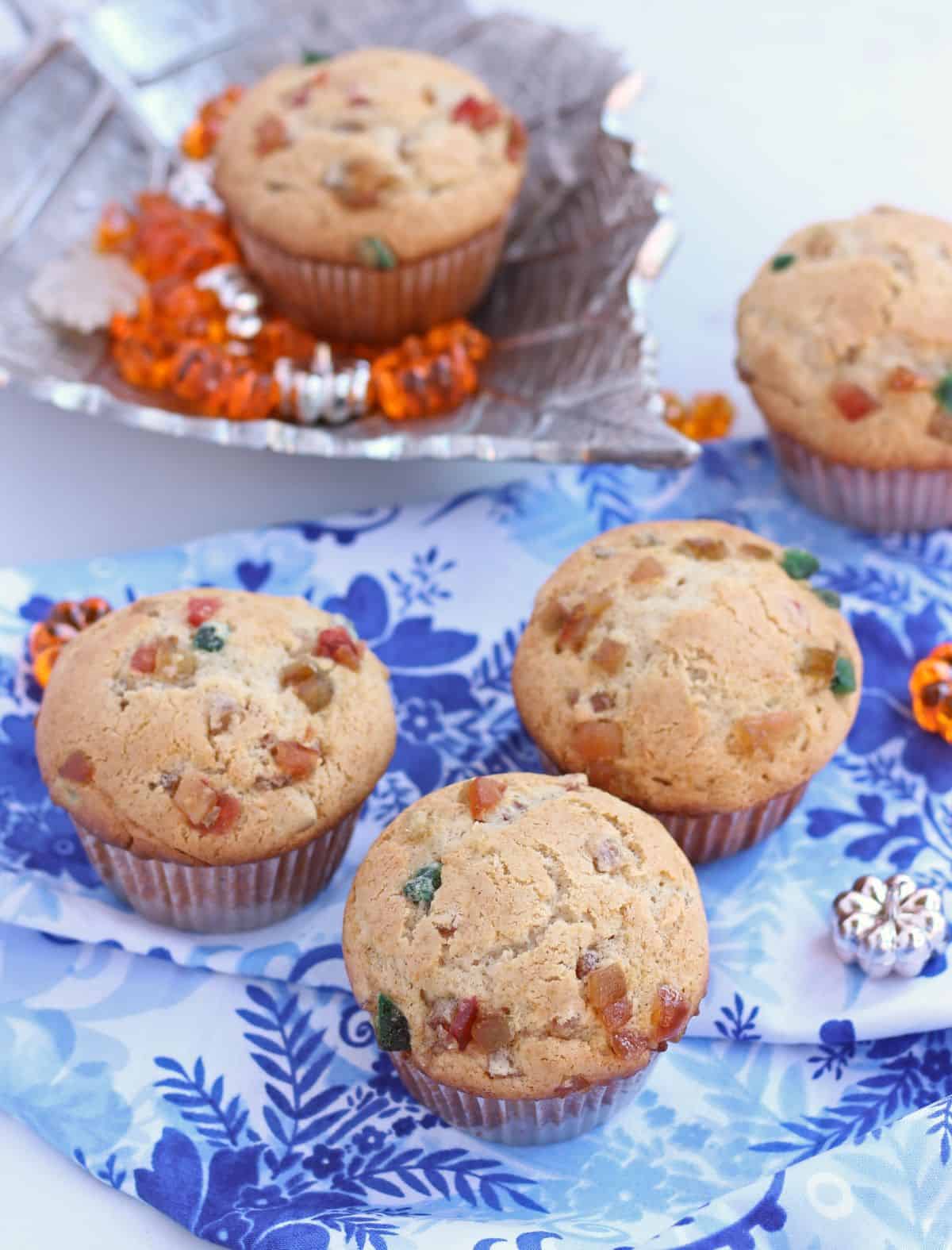 Muffin with mixed fruit in a blue cloth and plate.