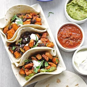 sweet potato ad black bean soft taco with sides.